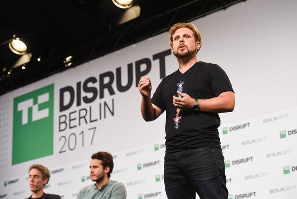 Abe Cambridge speaking on stage at TechCrunch Disrupt Berlin 2017